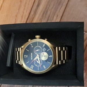 Nixon mens watch. Never been worn. Still in original box.